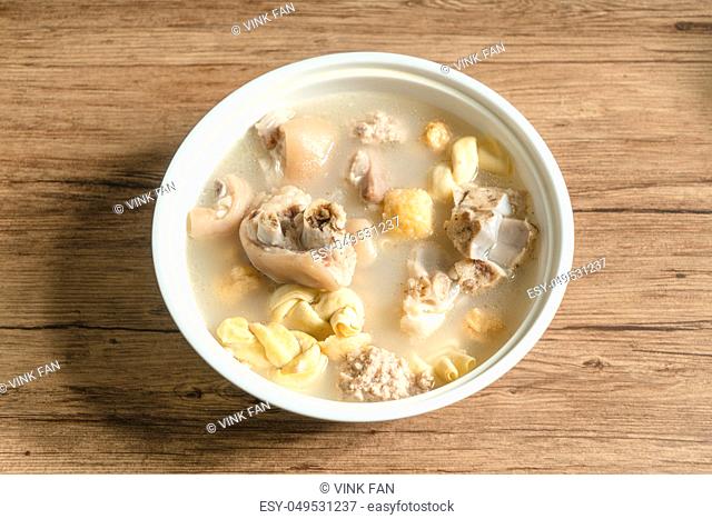 trotter soup with wooden background, homemade food, delicious soup