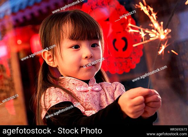 The lovely little girl with fireworks