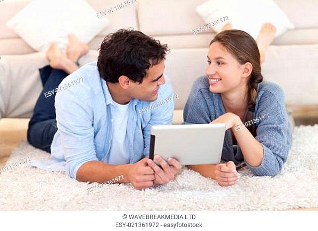 Cute couple using a tablet computer