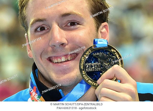 Marco Koch of Germany shows his gold medal after winning the Men's 200m Breaststroke Final of the 16th FINA Swimming World Championships at Kazan Arena in Kazan