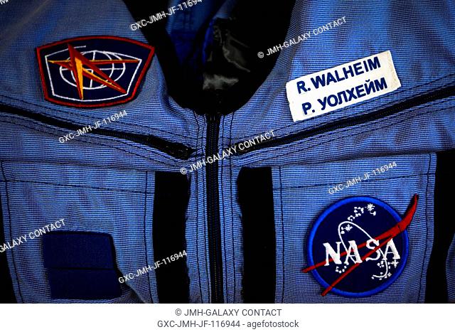 NASA astronaut Rex Walheim's name is seen in both English and Russian on a Penguin suit during a suit fit check at the Zvezda facility in Moscow on March 28