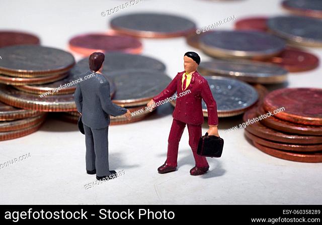 Two small buisness men making a deal