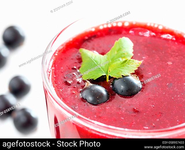 Delicious black currant smoothie with fresh berries. Shallow DOF. Selective focus