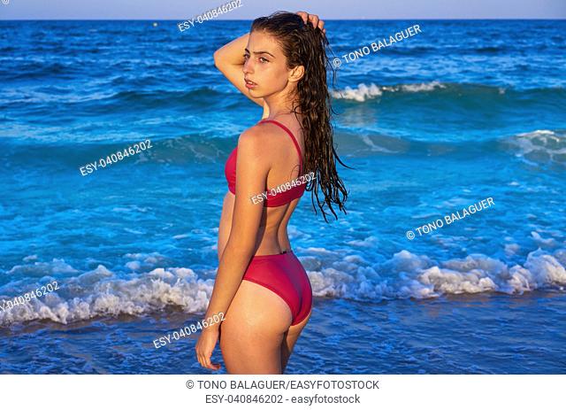 Bikini girl in the beach blue shore at summer Mediterranean sea