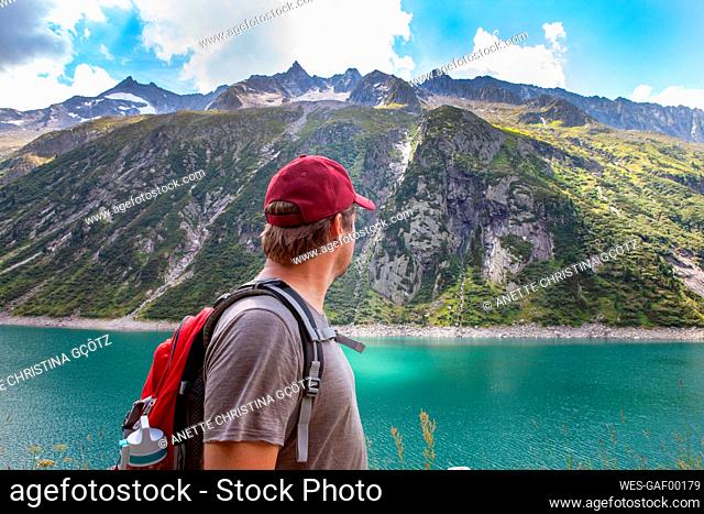 Mature man looking away by lake at Zillergrund, Austria