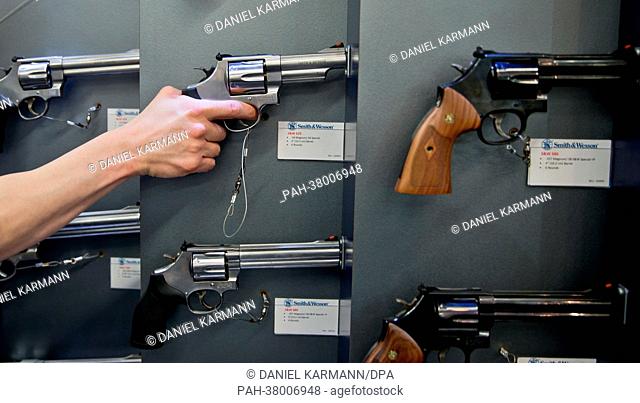 Visitor holds a Smith & Wesson (Model 44 Magnum) during the IWA & OutdoorClassics gun show in Nuremberg, Germany, 08 March 2013