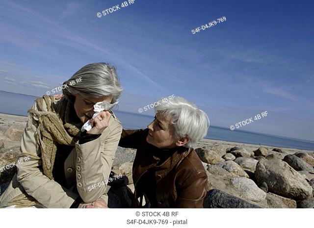 Mature woman consoling a friend