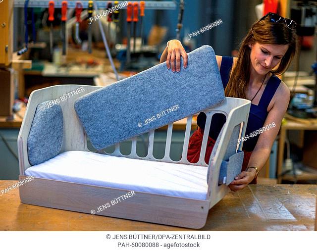 Design student Stella Buggenthin works on her graduation project, an adjustable bed for infants entitled 'Nido' (lit. nest)