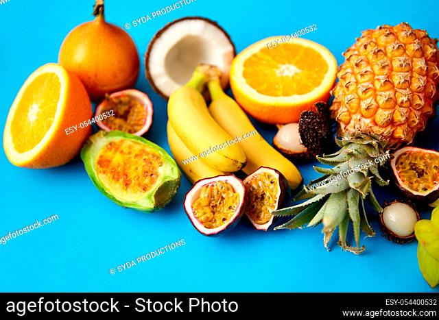 different exotic fruits on blue background