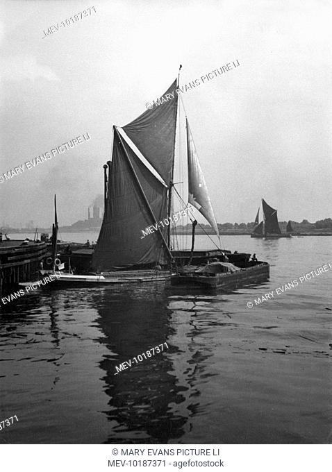 Sailing barges on the River Thames at Galleons Reach, the stretch of river between Woolwich and Barking and the entrance to the docks