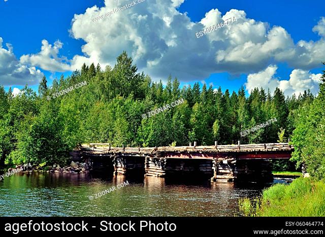 Old wooden bridge across the river Chirko-Kem. Karelia, Russia