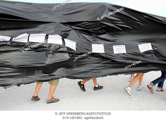 Florida, Miami Beach, oil spill protest, offshore drilling, black plastic sheet represents slick