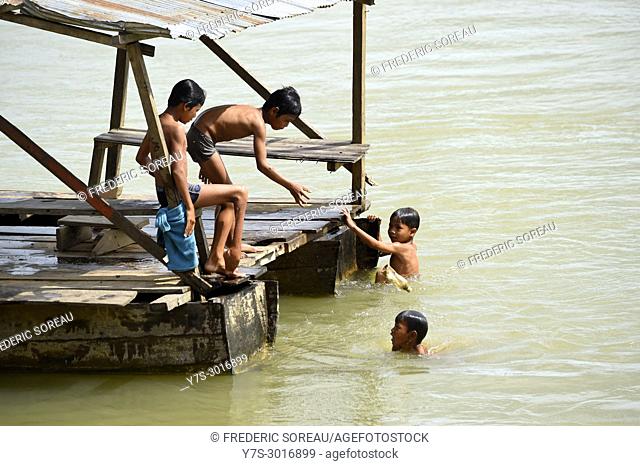 Children playing and swimming in a river, Ratanakiri Province, Cambodia, South East Asia, Asia