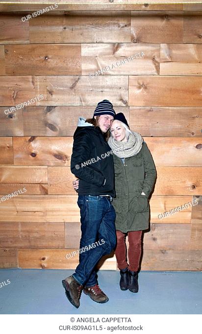 Portrait of mid adult couple in knitted hats