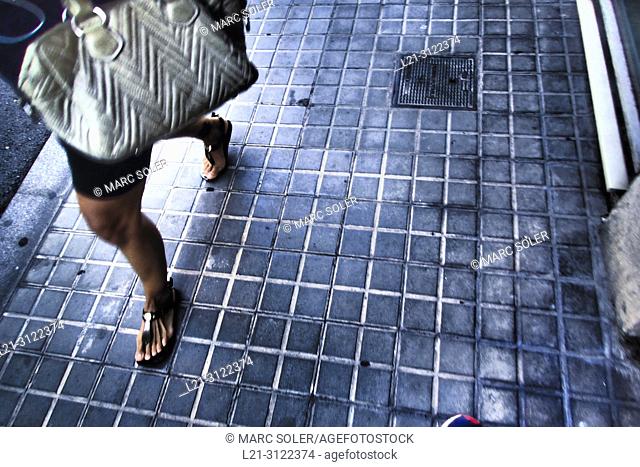 Woman walking on the street. Barcelona, Catalonia, Spain