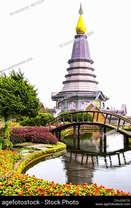 King and Queen Pagodas with colorful flower garden and wooden bridge which is popular for pictures at Doi Inthanon National Park, Chiang Mai, Thailand