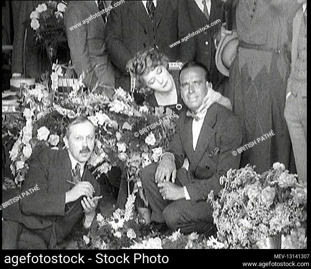 Mary Pickford and Douglas Fairbanks Senior Sitting Together Amongst A Bed Of Flowers In Paris - Paris, The French Third Republic, France