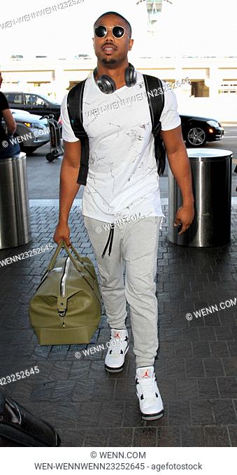 'Creed' star Michael B. Jordan departs on a flight from Los Angeles International Airport (LAX) carrying a backpack and holdall Featuring: Michael B