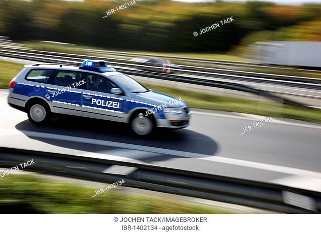 Police patrol car with flashing lights, Germany, Europe