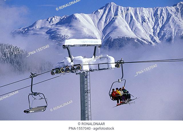 Chair-lifts in the freshly-snowed mountains above the village of Serfaus, in the Austrian Alps