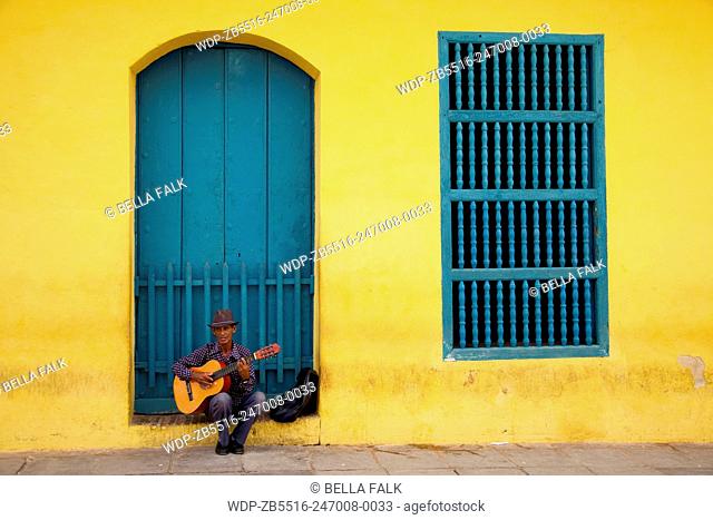A man plays guitar in Trinidad, Cuba