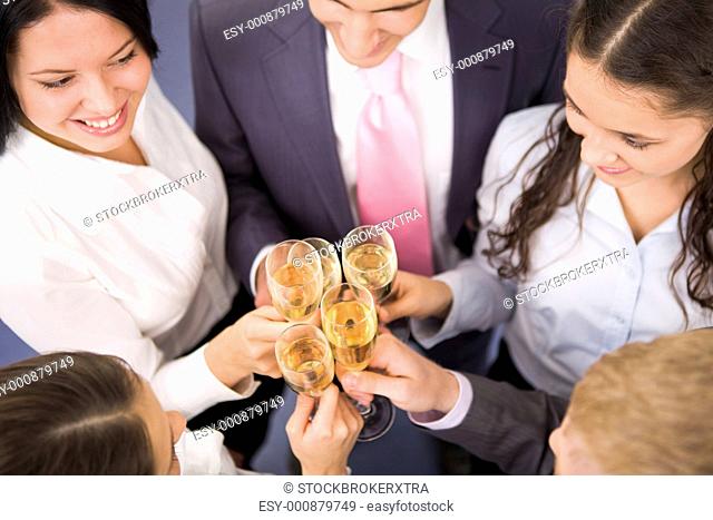 Photo of happy friends making toast during party