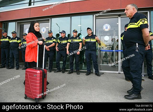 GEORGIA, TBILISI - MAY 19, 2023: Police officers gather at Shota Rustaveli Tbilisi International Airport ahead of the arrival of an Azimuth flight from Moscow