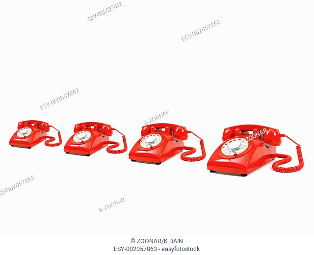 A row of telephones isolated against a white background