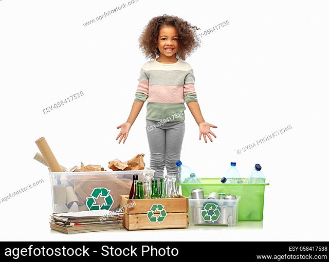 happy girl sorting paper, metal and plastic waste