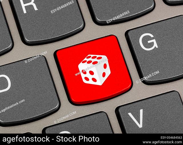 Computer keyboard with dice key - technology background
