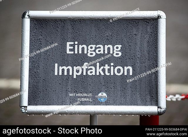 19 December 2021, North Rhine-Westphalia, Paderborn: Football: 2nd Bundesliga, SC Paderborn 07 - ""Entrance vaccination campaign"" is written on a sign in front...