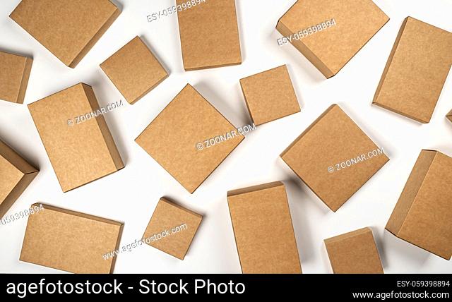 Blank brown cardboard boxes isolated on white background, top view with copy space, product package mock up