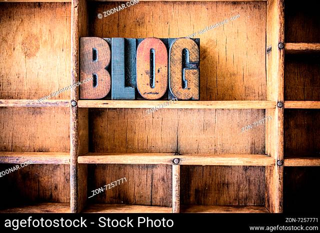 The word BLOG written in vintage wooden letterpress type in a wooden type drawer