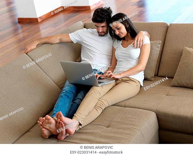 young couple making selfie together at home
