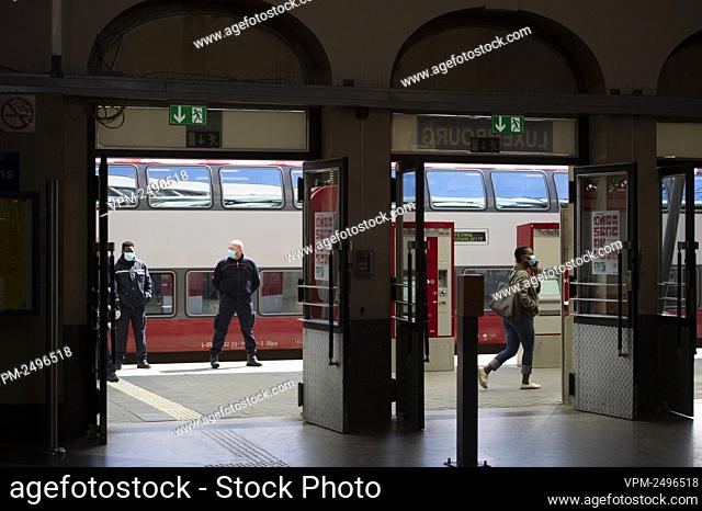Illustration picture shows people wearing masks in a bus station, in Luxembourg, Monday 20 April 2020. From Today on operators and users of public transport are...