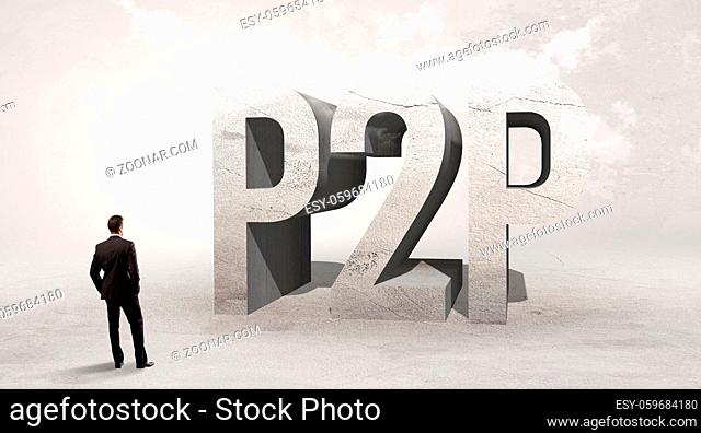 Rear view of a businessman standing in front of P2P abbreviation, attention making concept