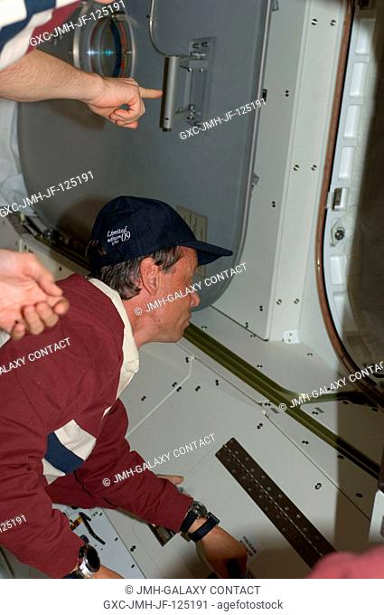 This is one of a series of digital still images that were recorded shortly after the STS-128 and Expedition 20 crewmembers reunited in space and not long after...