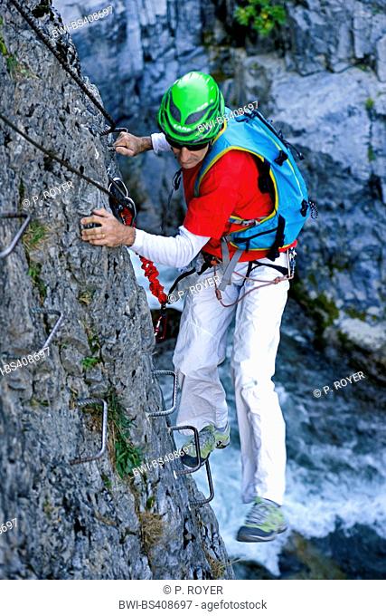 climber at Via ferrata of Chateau Queyras, France, Hautes Alpes