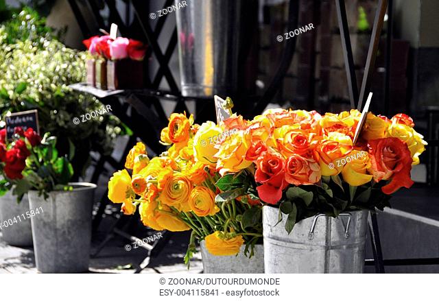 Orange and yellow roses on a florist stall