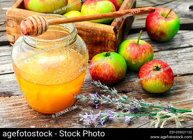 Fragrant summer apples and jar of honey