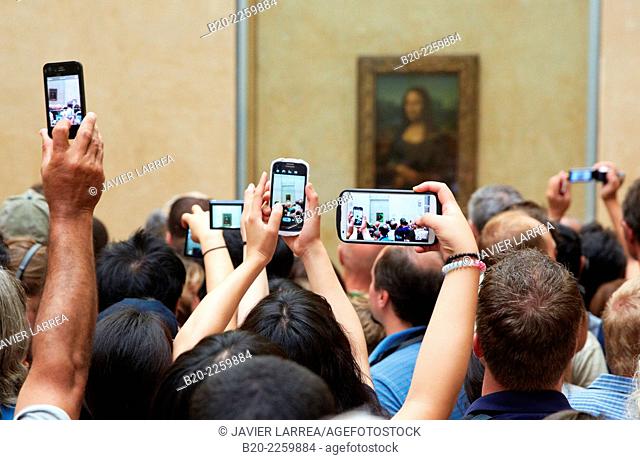 Tourists photographing Mona Lisa painting. Louvre Museum. Paris. France