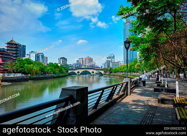 CHENGDU, CHINA - APRIL 15, 2018: Embankment quay of Jin river and Anshun bridge in Chengdu, Sichuan, China