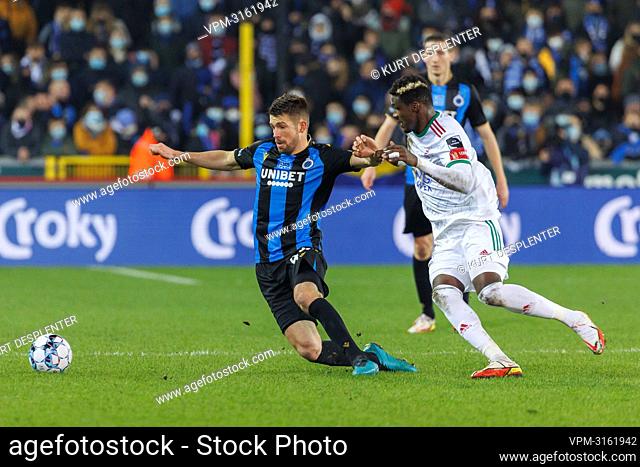 Club's Brandon Mechele and OHL's Sory Kaba fight for the ball during a soccer game between Club Brugge and OH Leuven, Thursday 23 December 2021 in Brugge