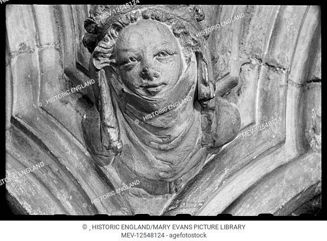 Detail of a sculpture on the south aisle wall of St John's Minster Church, showing the bust of a woman wearing a wimple with crown over the top