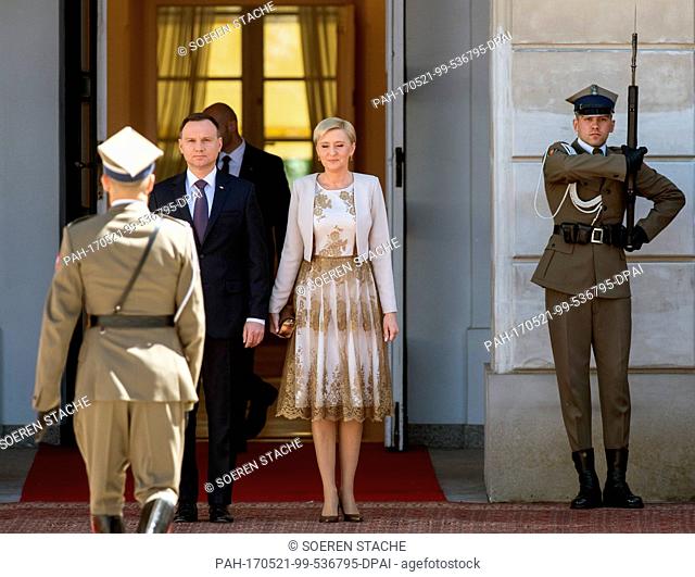 Polish President Andrzej Duda (2-L) and his wife Agata Kornhauser-Duda (C) await the arrival of German President Frank-Walter Steinmeier (not pictured) in front...