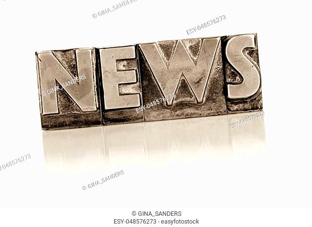 the word news written with lead letters. symbol photo for newsletters, newspapers and information