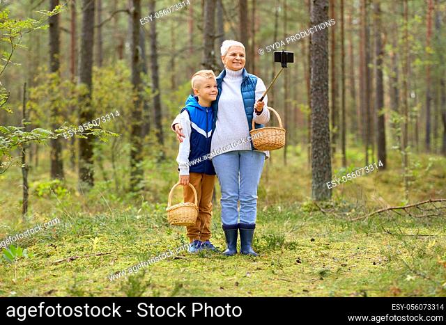 grandmother and grandson with baskets take selfie