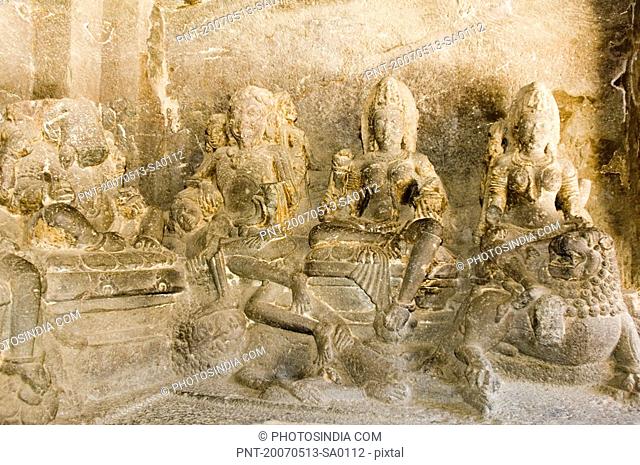 Statues of Hindu gods carved in a cave, Ellora, Aurangabad, Maharashtra, India