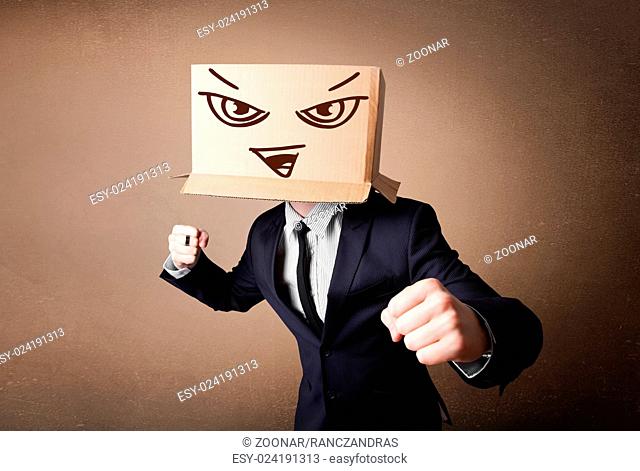 Businessman gesturing with a cardboard box on his head with evil face