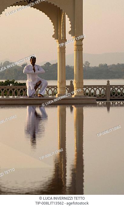 India, Udaipur, Rajasthan, Uberoi Udai Vilas Hotel, man doing yoga